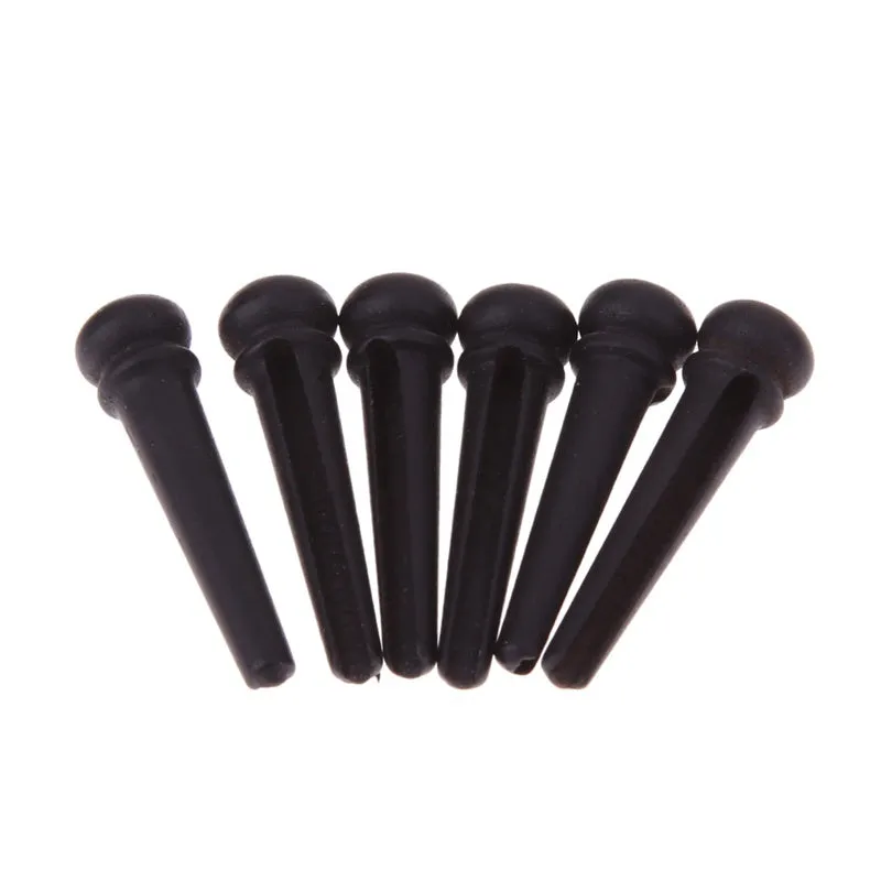 Six ebony folk guitar string nails with 5.3mm bayonet diameter in matt black finish