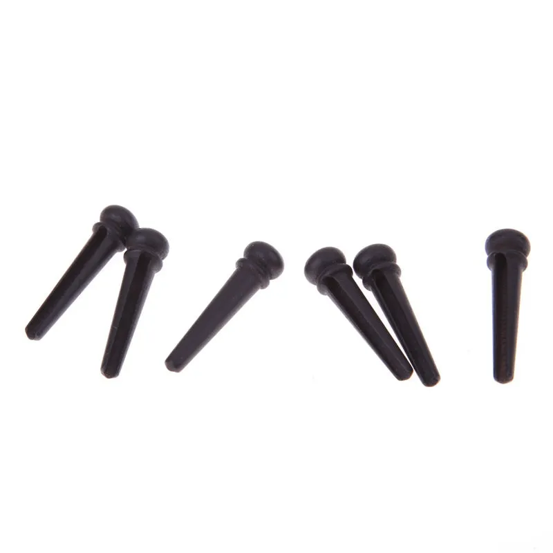 Six ebony folk guitar string nails with 5.3mm bayonet diameter in matt black finish