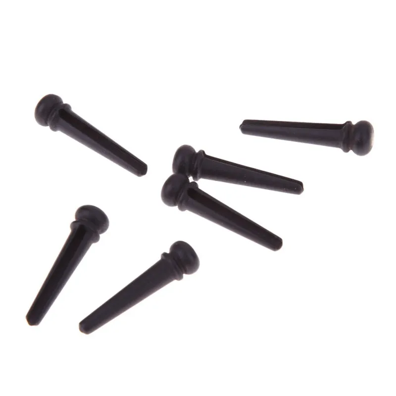 Six ebony folk guitar string nails with 5.3mm bayonet diameter in matt black finish