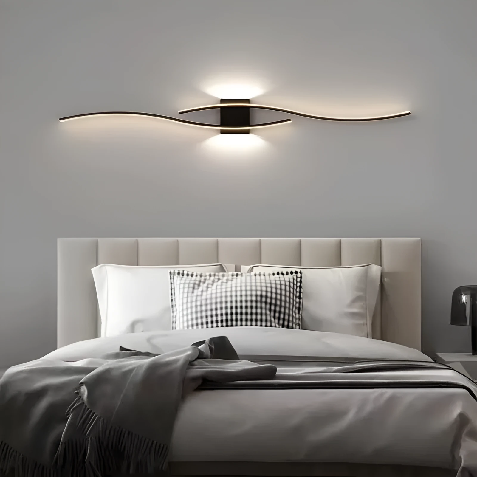 Black 60cm bedside wall lamp with acrylic panel and wrought iron frame on neutral wall