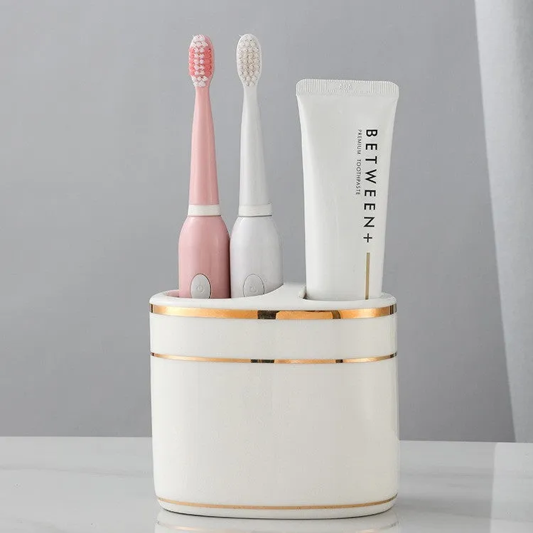 Ceramic toothbrush rack in household light luxury style with three colour options on a bathroom counter