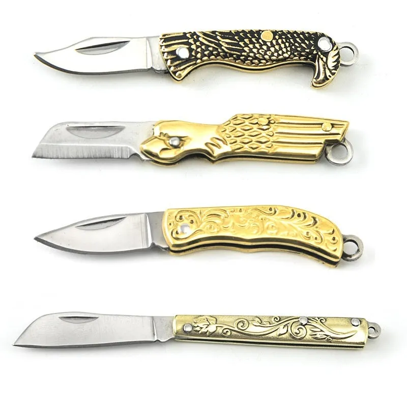 Brass mini folding knife keychain pendant with 3cm blade and 42mm shank on a key ring