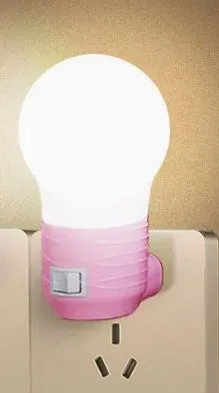 Plug-in bedside baby night light with round design in white, blue or pink shell colours
