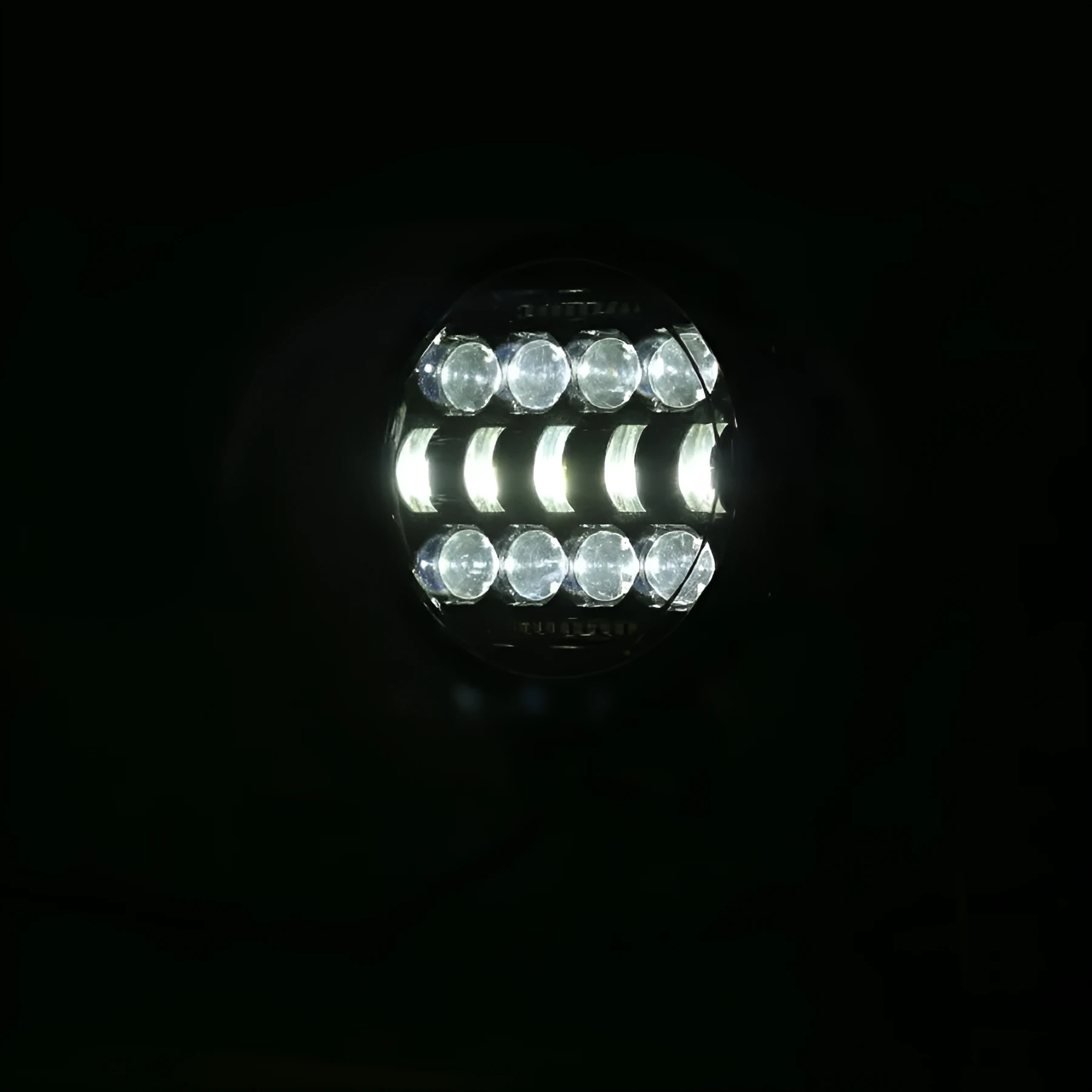7-inch circular black LED headlight with spot beam, die-cast aluminium housing, IP67 waterproof rating for off-road vehicles