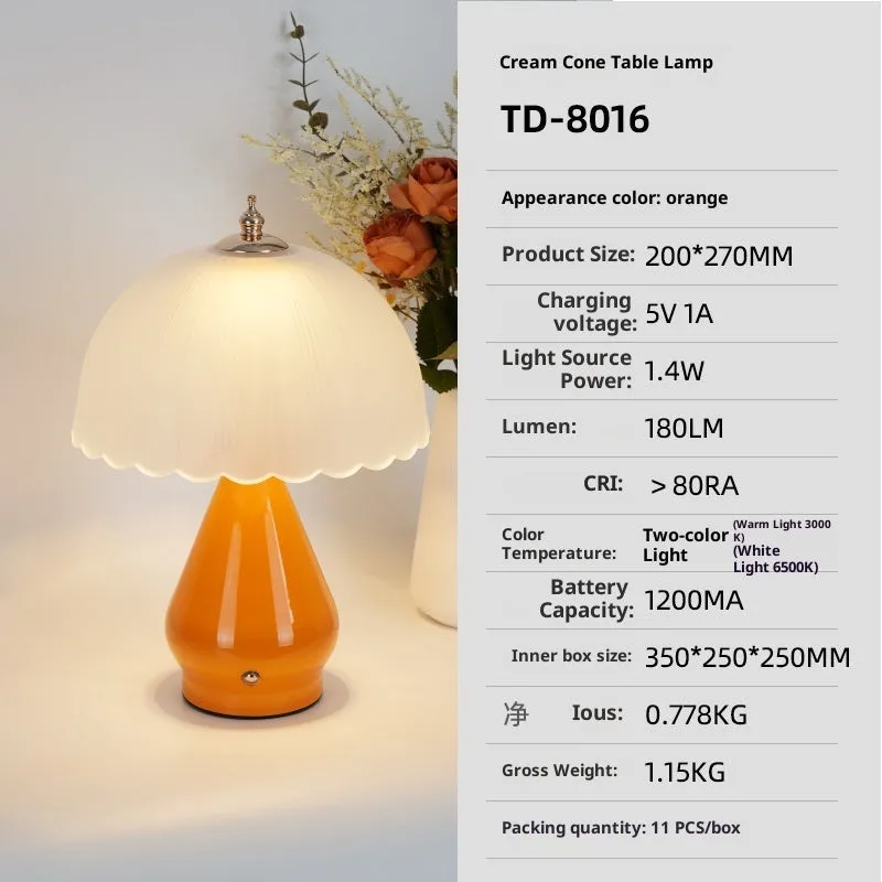 Geometric 3D table lamp in black with warm light on a wooden side table in a modern living room