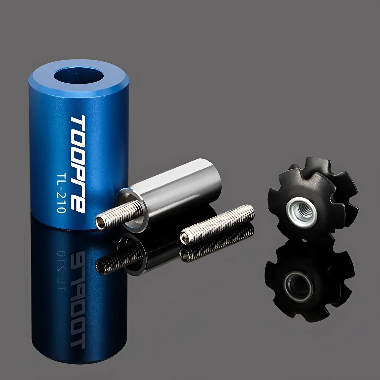 Blue sunflower driving tool for bicycle bowl group hanging core installation, made from aluminium alloy and stainless steel, on a workbench.