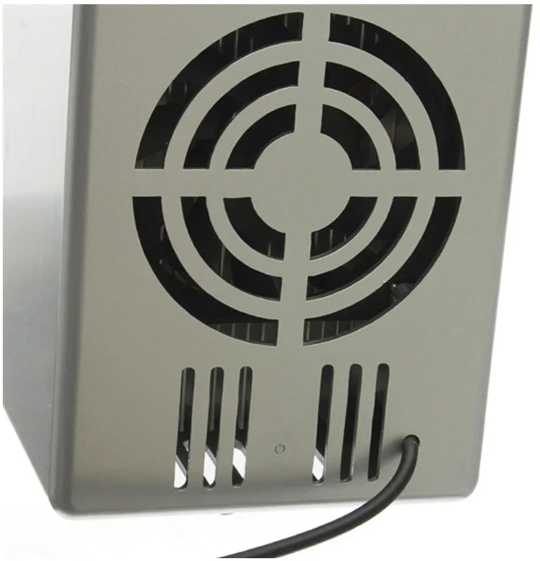 Silver USB mini fridge with LED light, holding two cans, compact size for desk