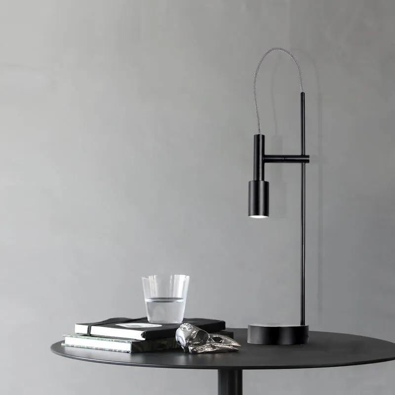 Simple modern rotating table lamp in sand black finish with wrought iron base and G9 bulb, suitable for bedside use