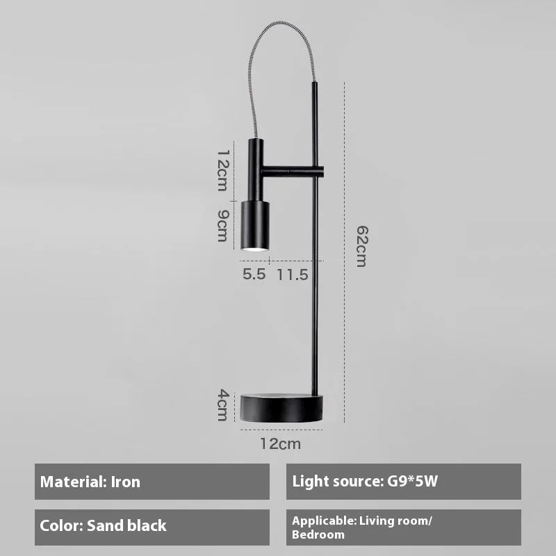 Simple modern rotating table lamp in sand black finish with wrought iron base and G9 bulb, suitable for bedside use