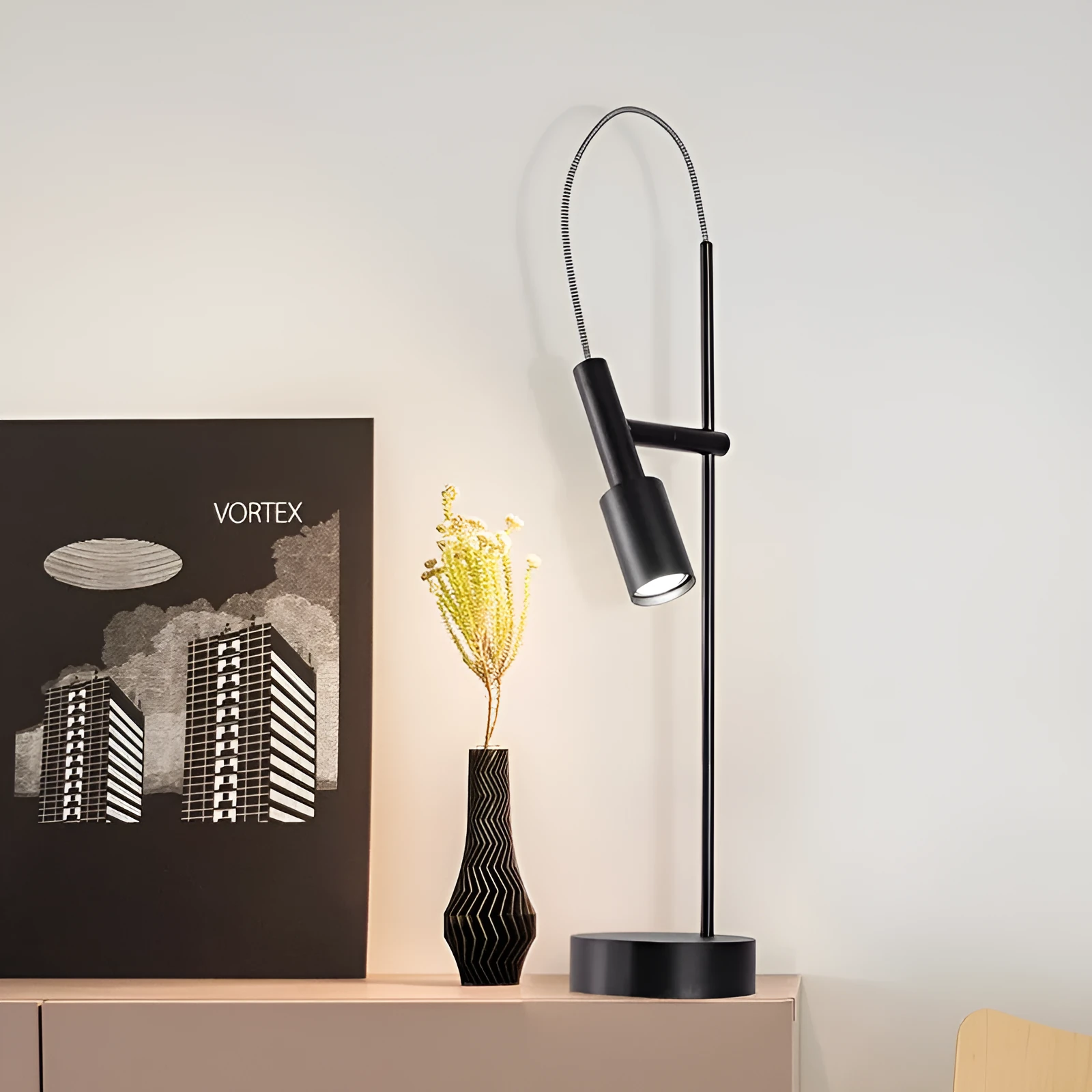 Simple modern rotating table lamp in sand black finish with wrought iron base and G9 bulb, suitable for bedside use
