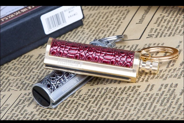 Waterproof metal sticker windproof lighter with red leather cover showing metal body and sticker design