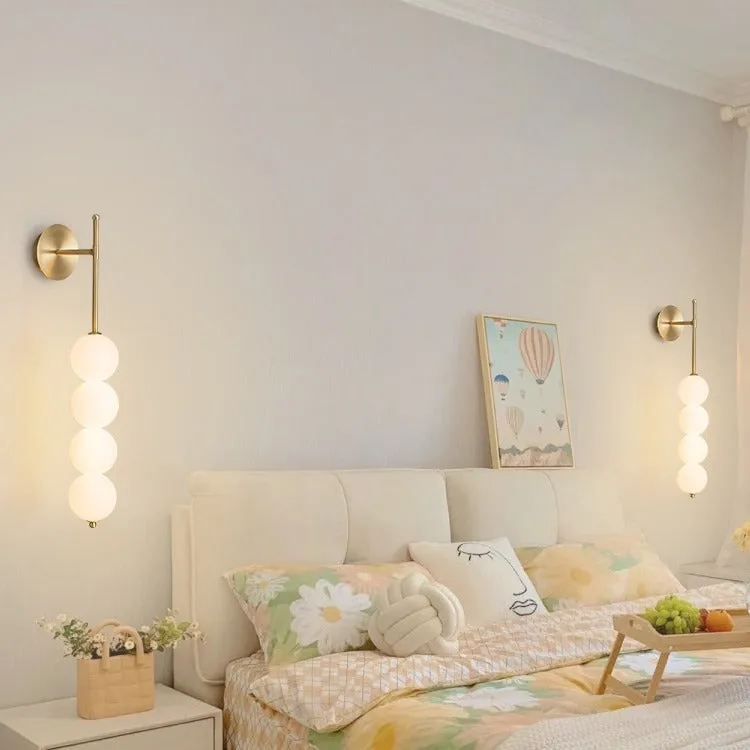 Nordic wall lamp in gold finish with tricolour light, rotomoulded construction for bedside atmosphere