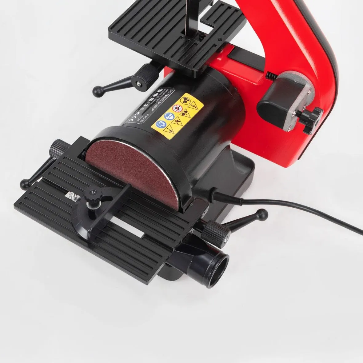 Small electric disc and belt sander for household use with EU plug and power cord on workbench