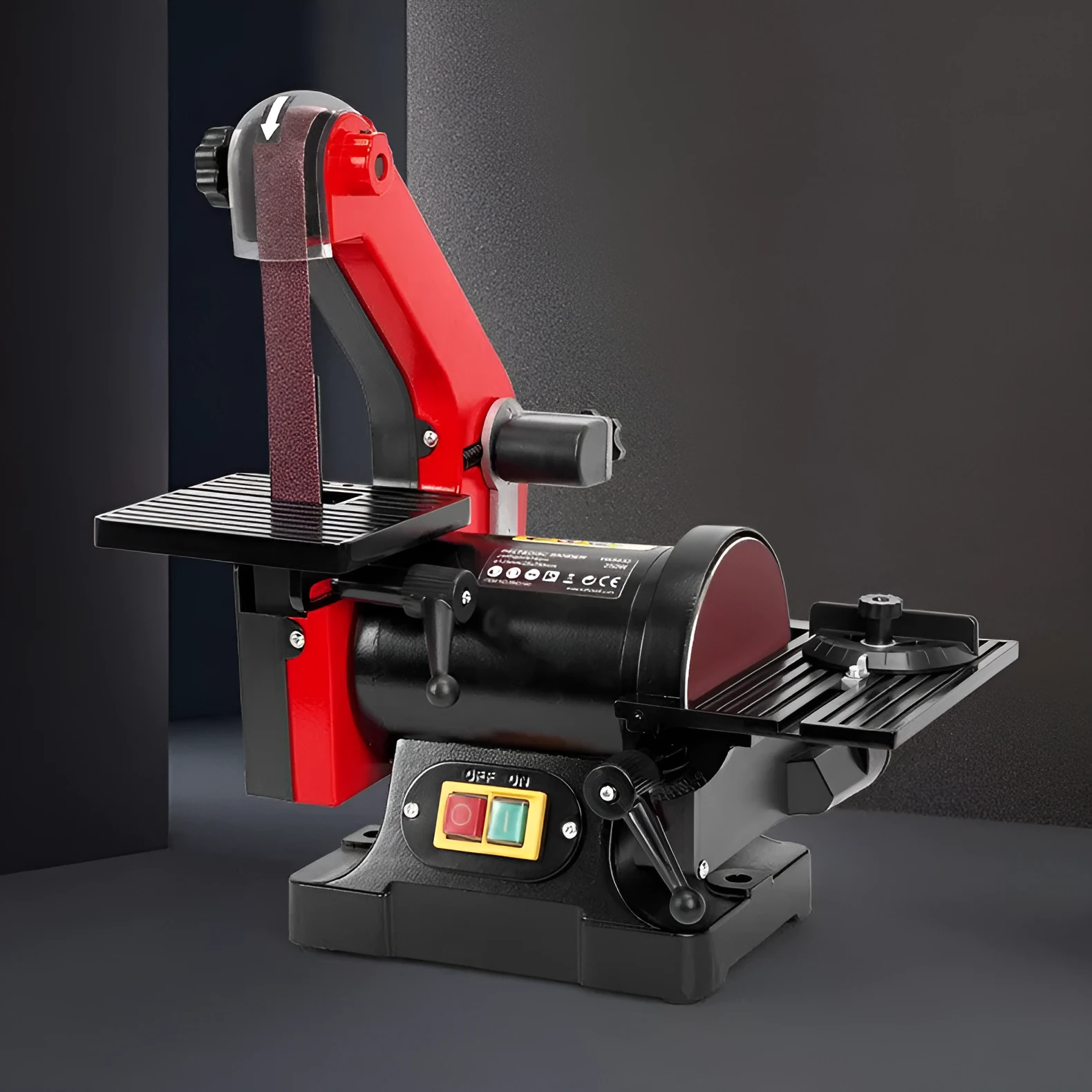Small electric disc and belt sander for household use with EU plug and power cord on workbench