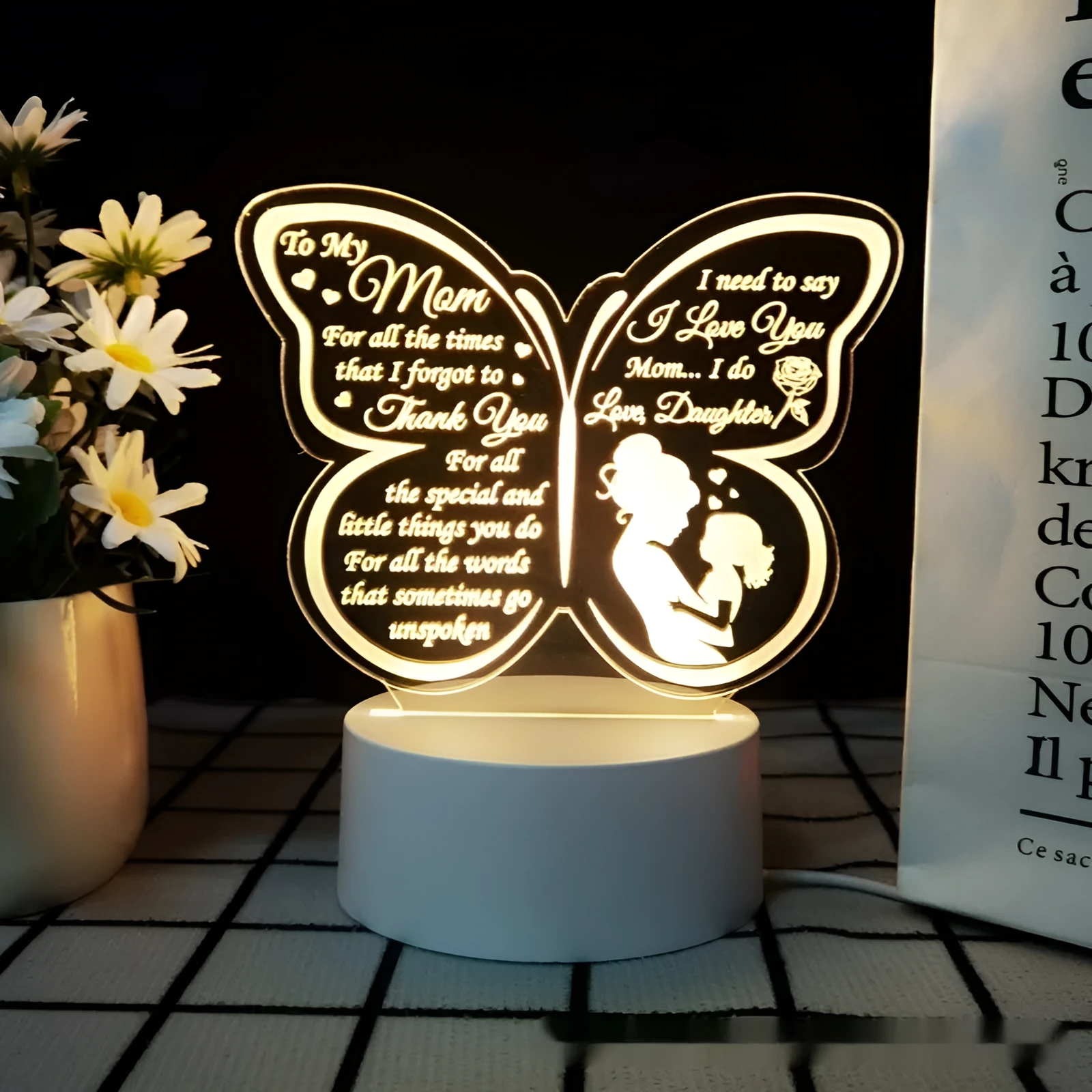 White heart-shaped acrylic table lamp with touch switch on a wooden surface.