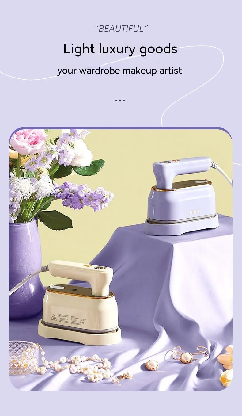 Milky white foldable portable steam iron with ceramic soleplate and international plug adaptors.