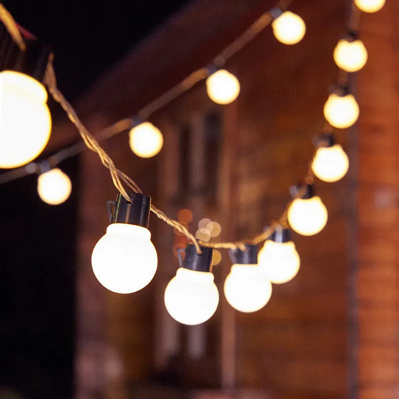 10 metre solar powered decorative festoon lights with 40 LED bulbs for festival tents in black with warm white LEDs