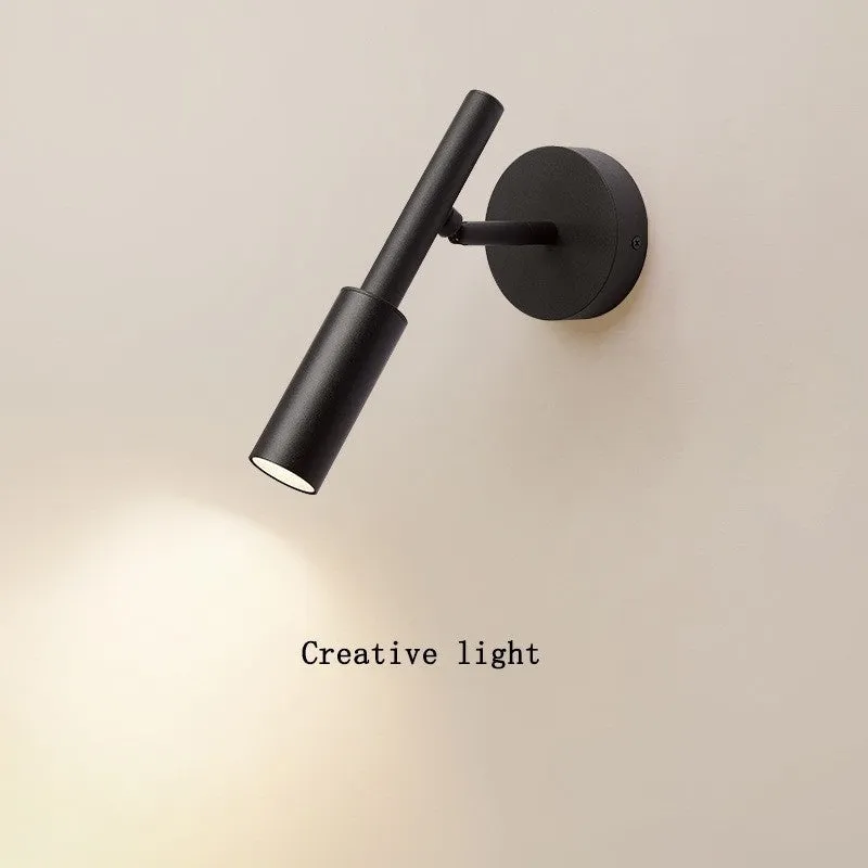 Modern wrought iron wall lamp in black or white with three colour light options
