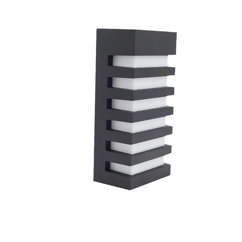 Modern minimalist layered aluminium outdoor wall lamp mounted on a wall.