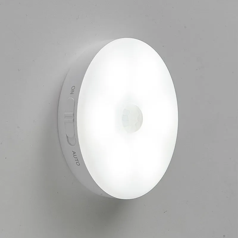 Two compact wireless motion sensor lights with induction charger.