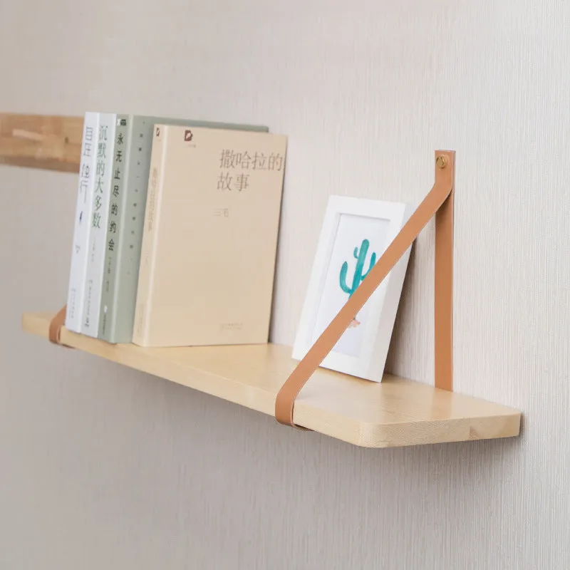 Pine wood wall-mounted storage shelf, 50cm wide by 16cm high, holding books and cosmetic items.