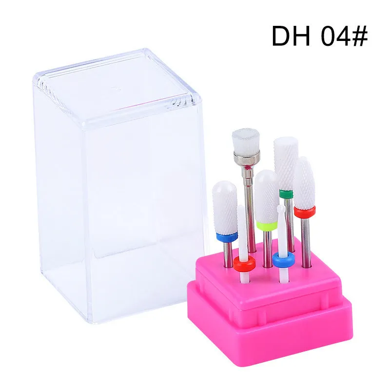 Set of seven tungsten steel nail drill bits and a brush in a transparent plastic case.