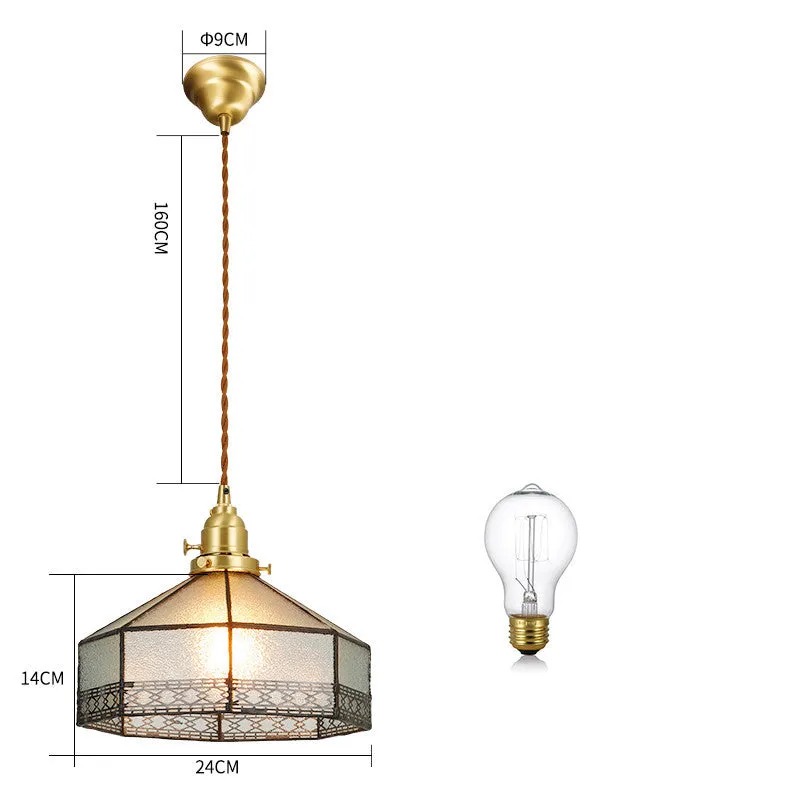 Retro brass and hand-blown glass chandelier with a hemp rope light line hanging from a ceiling.