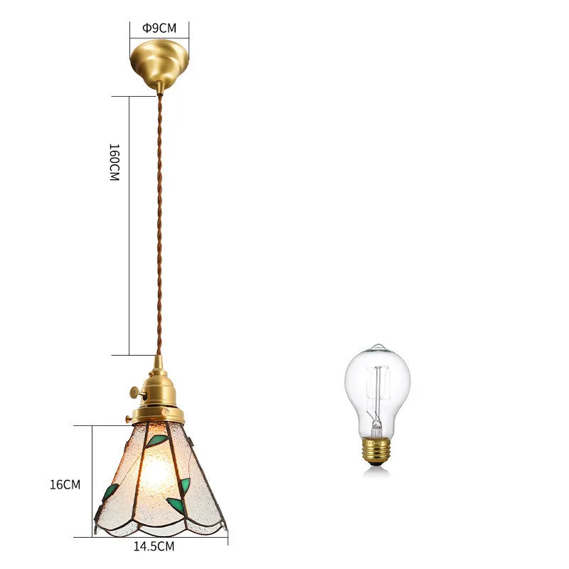 Retro brass and hand-blown glass chandelier with a hemp rope light line hanging from a ceiling.
