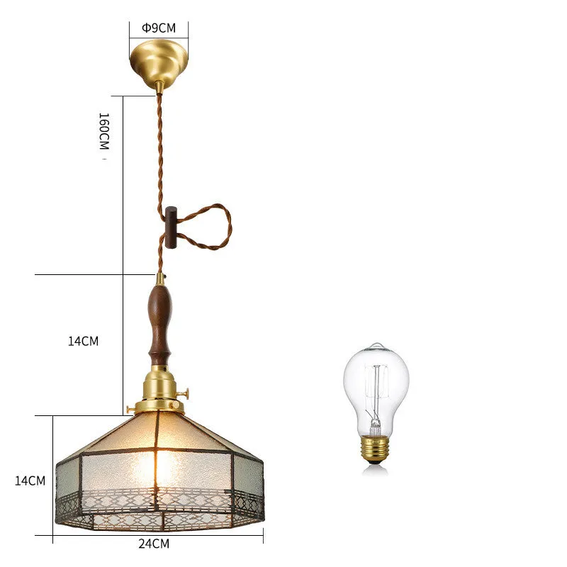 Retro brass and hand-blown glass chandelier with a hemp rope light line hanging from a ceiling.