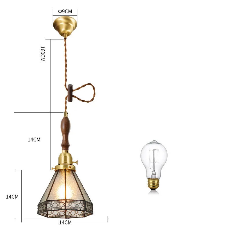 Retro brass and hand-blown glass chandelier with a hemp rope light line hanging from a ceiling.