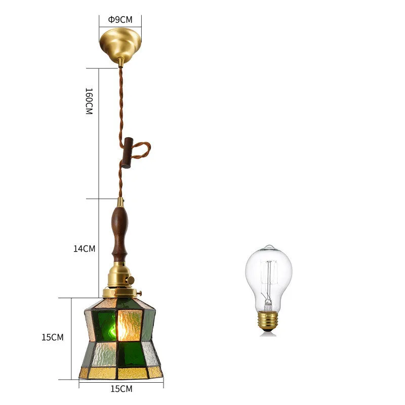 Retro brass and hand-blown glass chandelier with a hemp rope light line hanging from a ceiling.