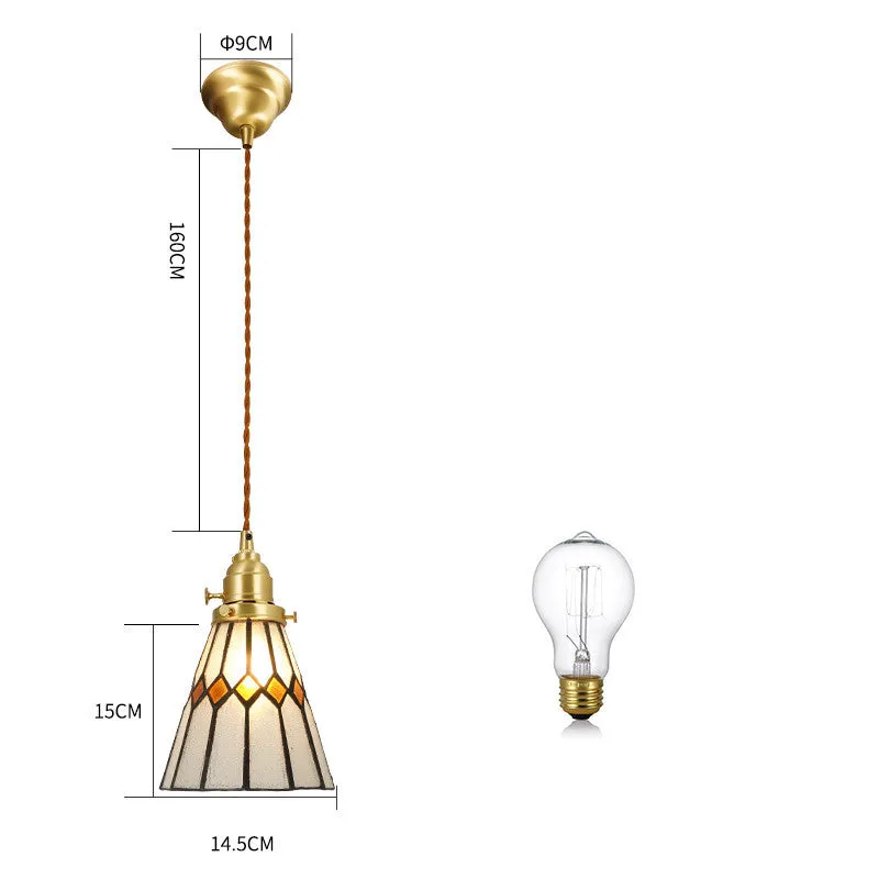 Retro brass and hand-blown glass chandelier with a hemp rope light line hanging from a ceiling.