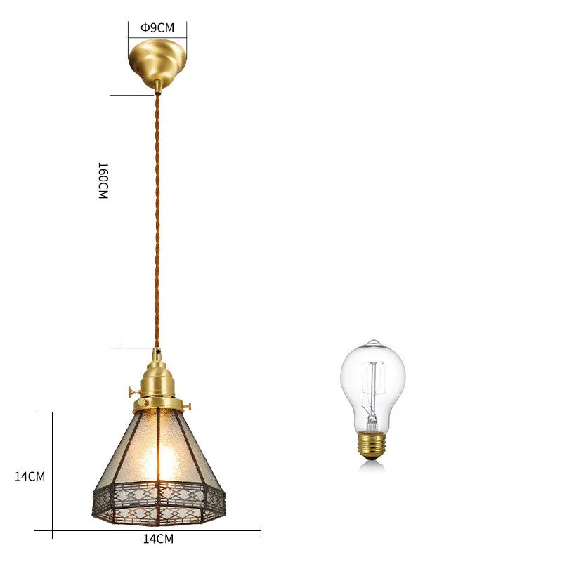 Retro brass and hand-blown glass chandelier with a hemp rope light line hanging from a ceiling.