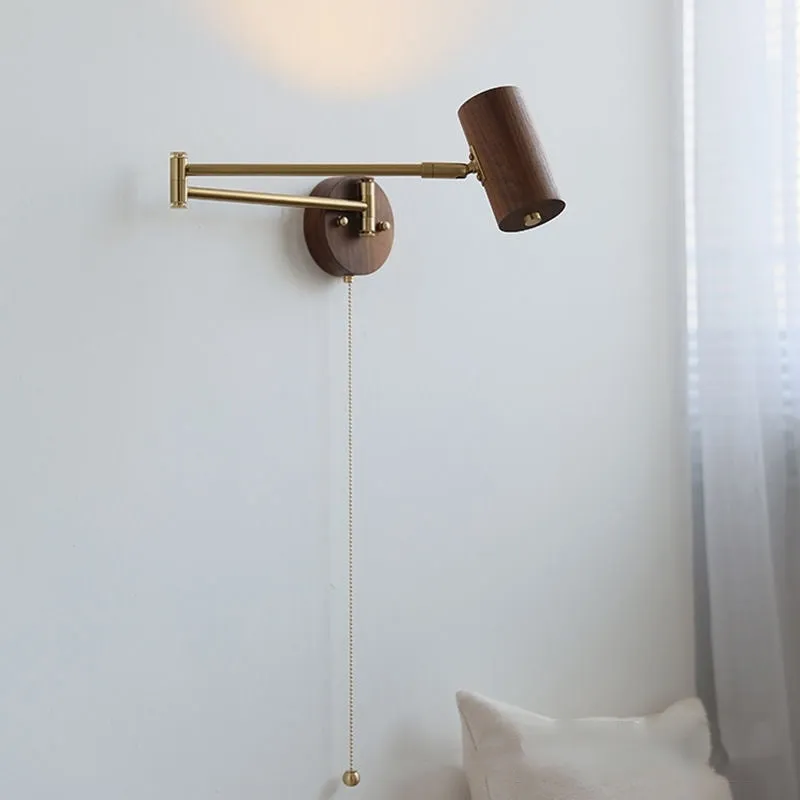 Retro-style long-arm wall spotlight with rotating head in walnut finish and a ribbon pull switch.