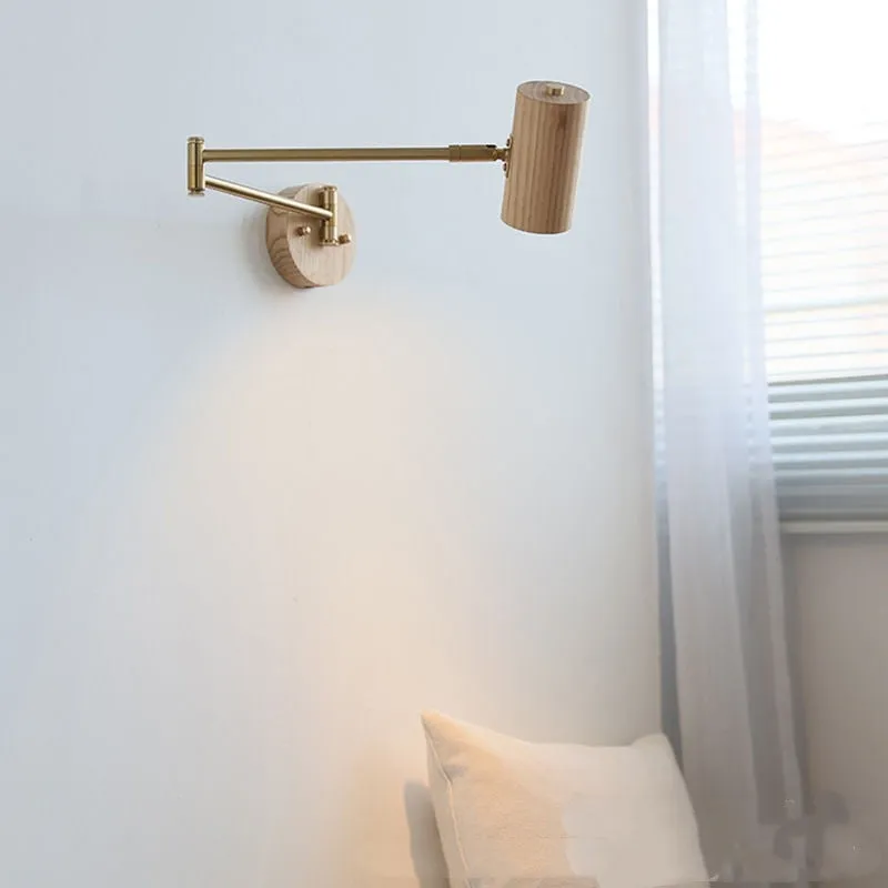 Retro-style long-arm wall spotlight with rotating head in walnut finish and a ribbon pull switch.