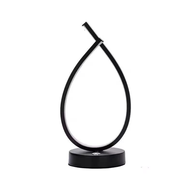 Small black or white creative desk lamp with USB cable, 30cm tall on a wooden table.