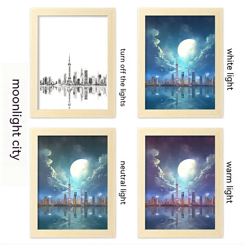 USB LED picture frame night lamp showing illuminated landscape artwork in modern plastic frame