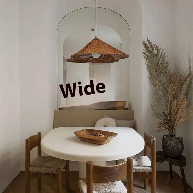 Silent Wind style natural rattan woven ceiling lamp hanging, showing its textured weave and circular shape.