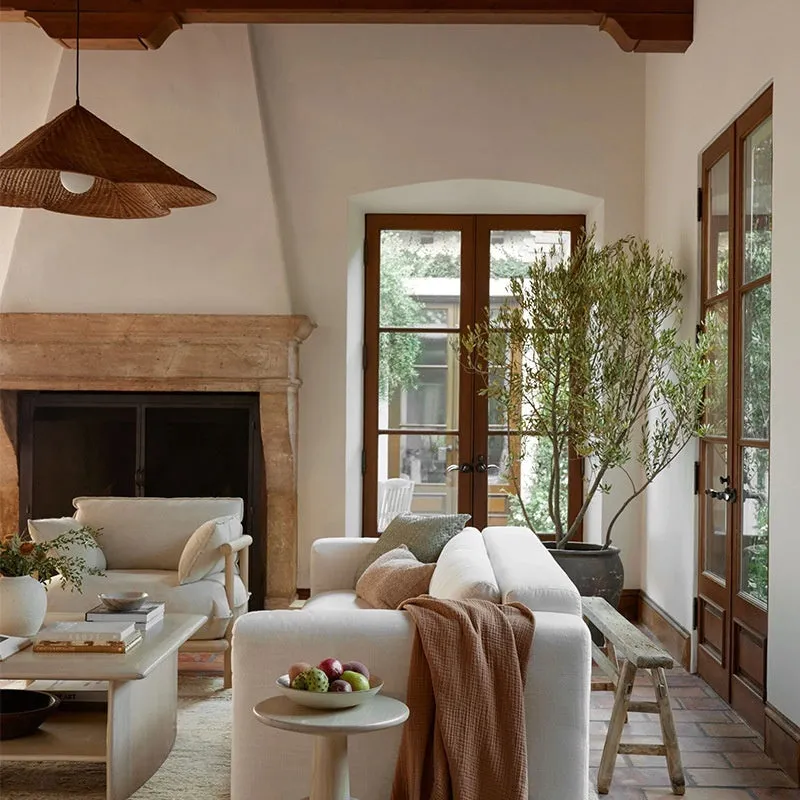 Silent Wind style natural rattan woven ceiling lamp hanging, showing its textured weave and circular shape.