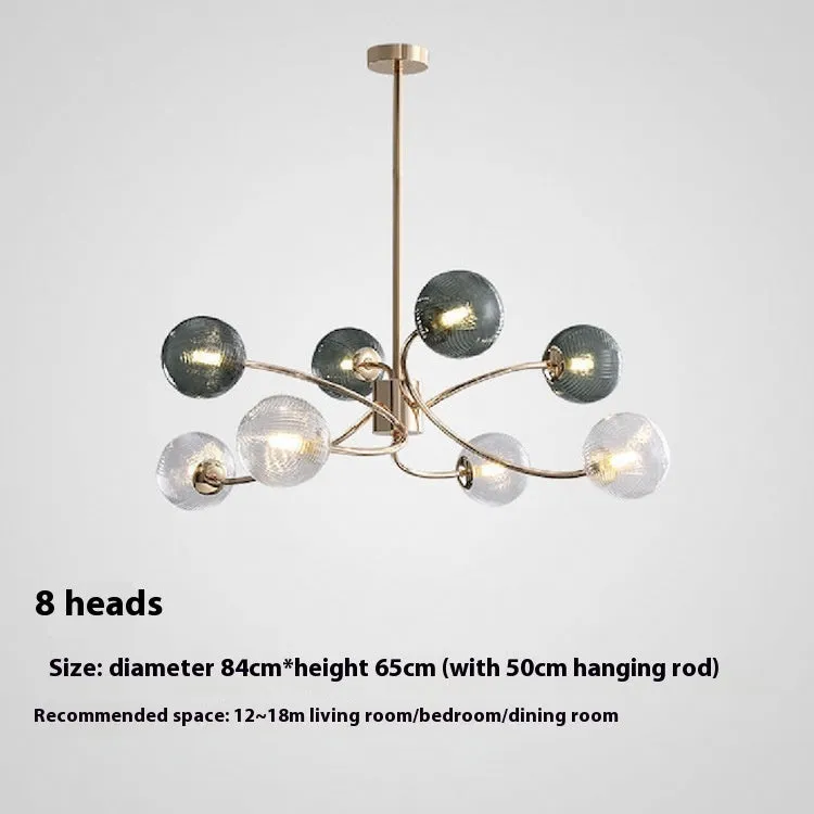 Modern Nordic style multi-head pendant chandelier with green clear lights for a living room.