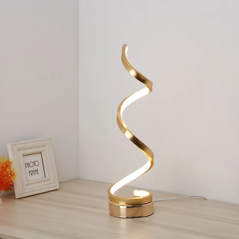 Black minimalist LED bedside table lamp with aluminium shade and metal base on wooden table