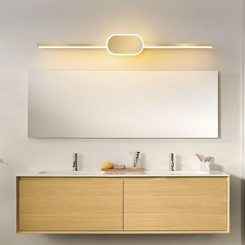 Modern bathroom mirror cabinet with LED vanity lights and a gold-toned frame.