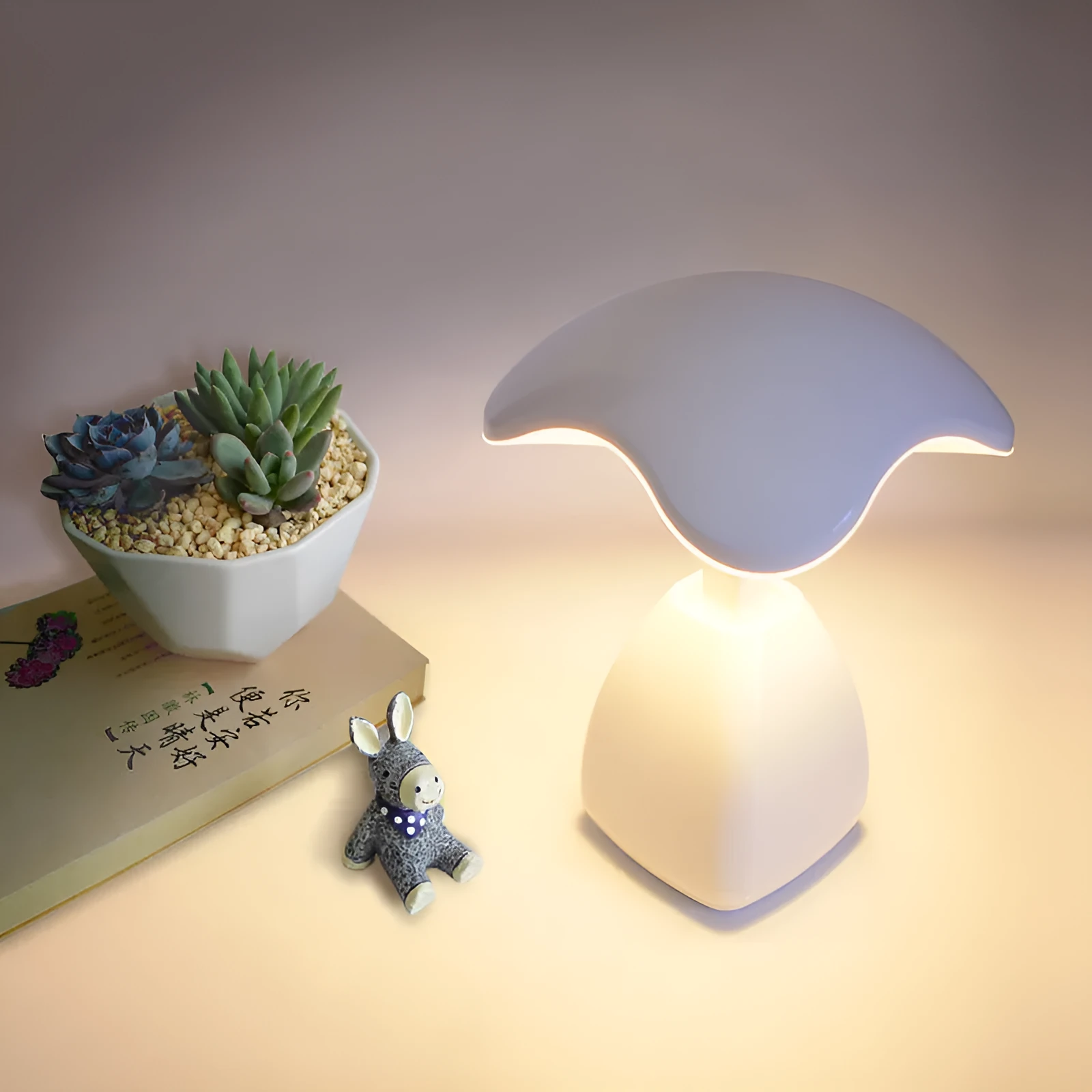 White modern LED desk lamp with plastic shade and touch controls on wooden desk