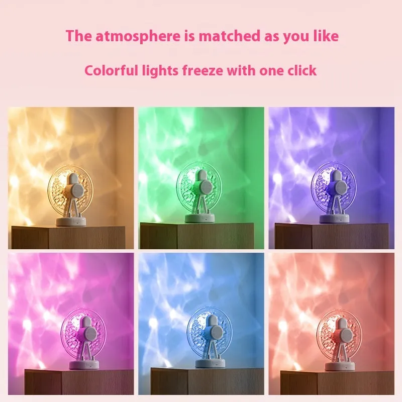 Pink Ferris wheel Bluetooth speaker projecting colourful water ripple light patterns on a surface.