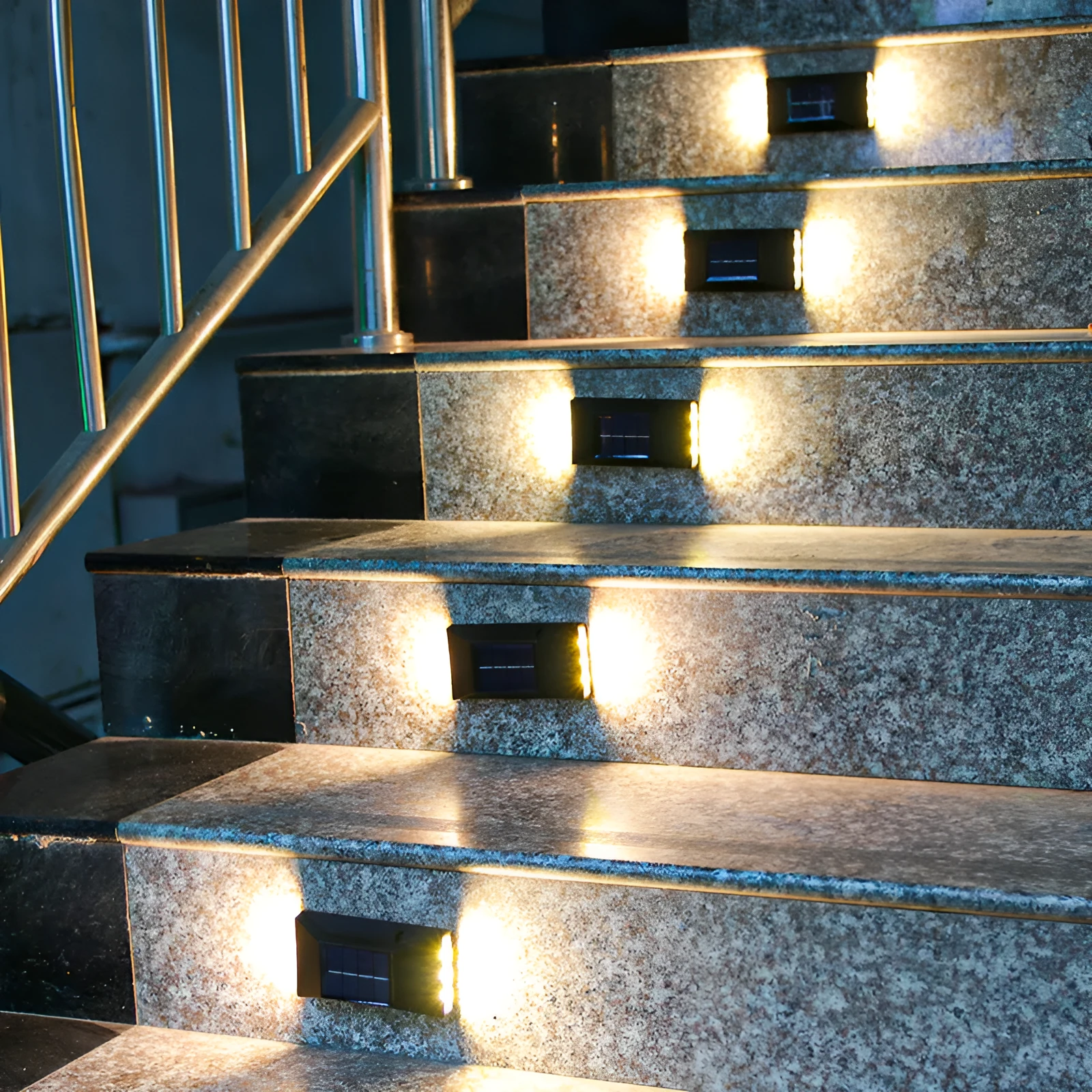 Solar-powered outdoor garden wall light in plastic or stainless steel with LED illumination