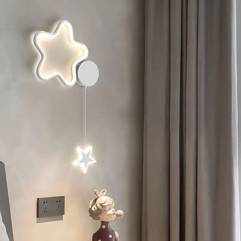 White left-facing cloud children's bedside wall lamp with a three-colour LED light on a bedroom wall.