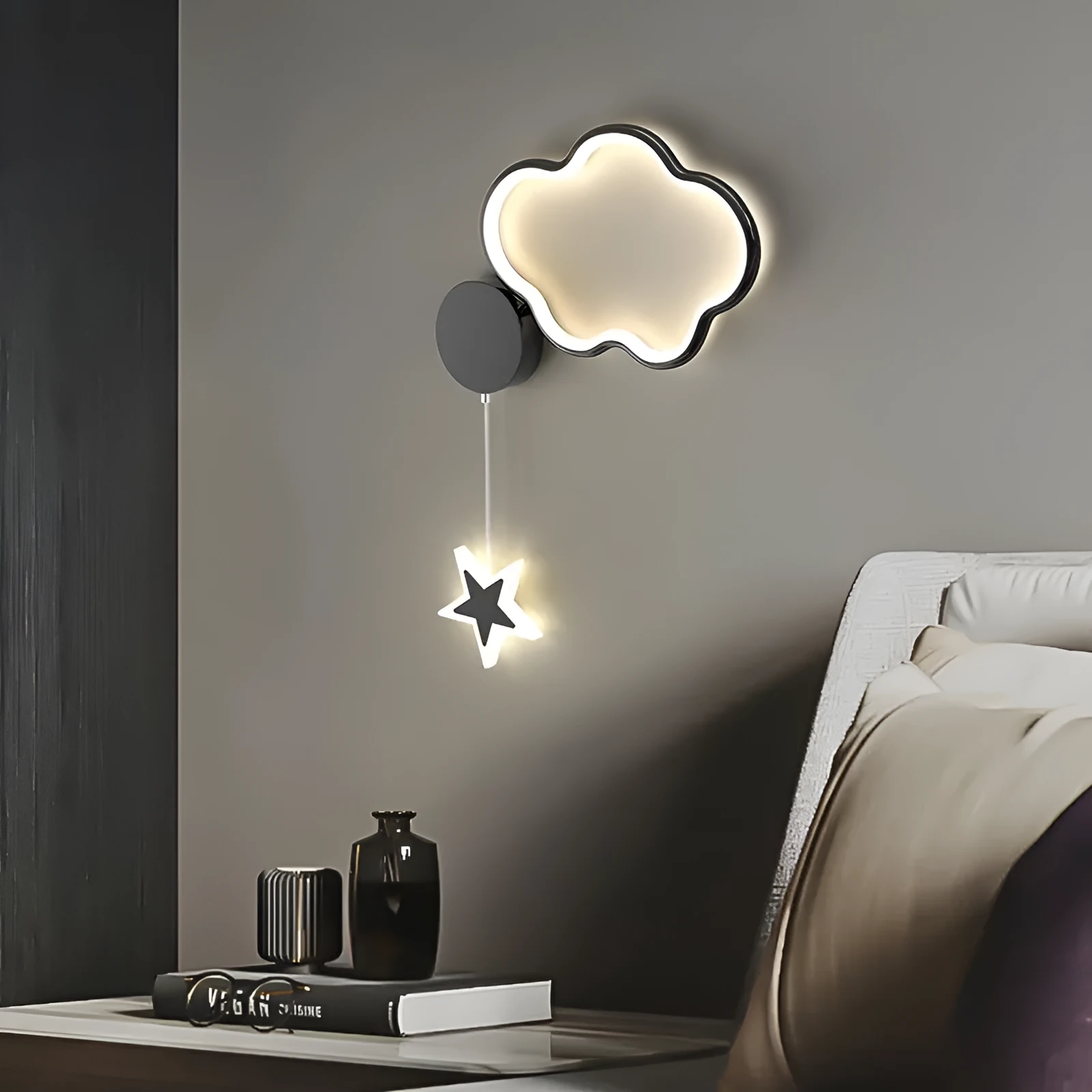 White left-facing cloud children's bedside wall lamp with a three-colour LED light on a bedroom wall.