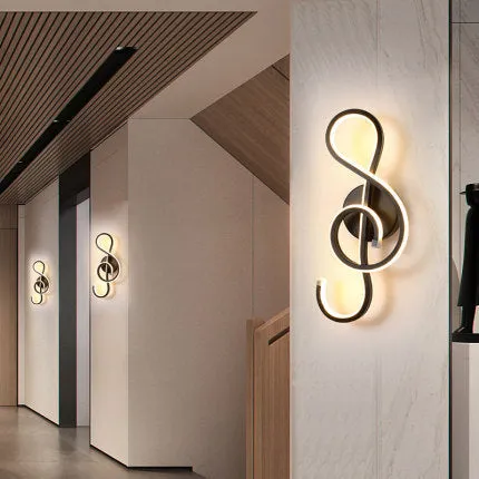 Nordic minimalist LED wall lamp with silicone shade in black finish mounted beside bed
