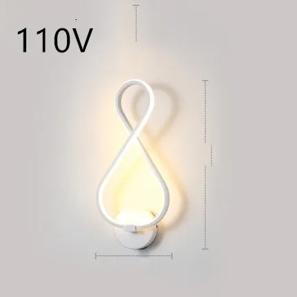 Nordic minimalist LED wall lamp with silicone shade in black finish mounted beside bed
