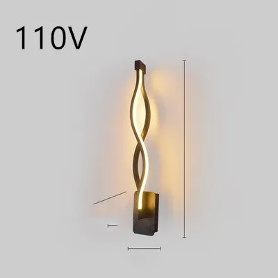 Nordic minimalist LED wall lamp with silicone shade in black finish mounted beside bed